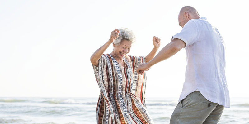 Woman and man having fun on a beach