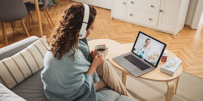 Woman telehealthing doctor